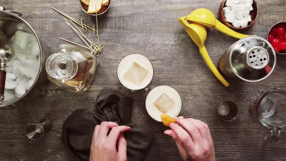 Step by step. Garnishing whiskey sour cocktail at home bar.