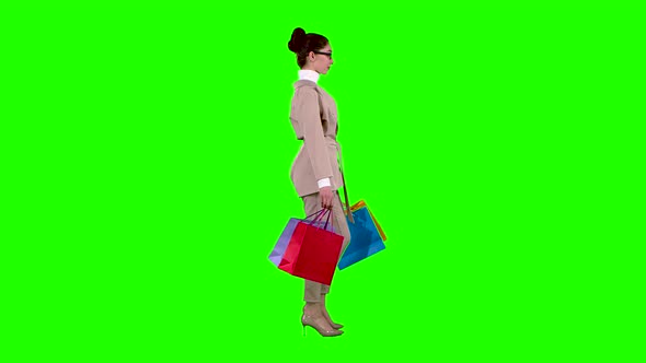 Girl Goes Shopping in the Store. Green Screen. Slow Motion