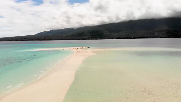 aerial drone shot over exotic island beach tropical paradise in Asia with tourist enjoying their vac