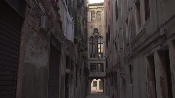 Tilt up shot of narrow historic street in Venice, Italy