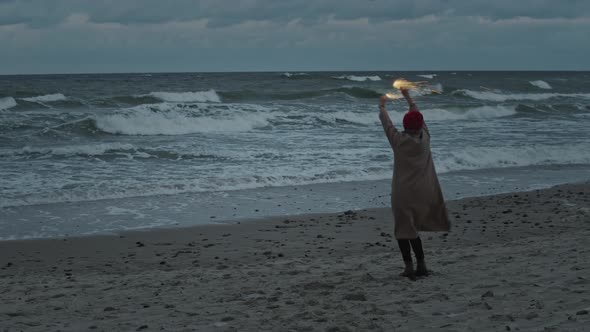 Woman Celebrate On The Ocean Coast With Fireworks Sparkles