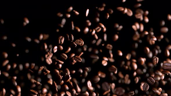 Super Slow Motion Shot of Exploding Premium Coffee Beans Isolated on Black at 1000Fps