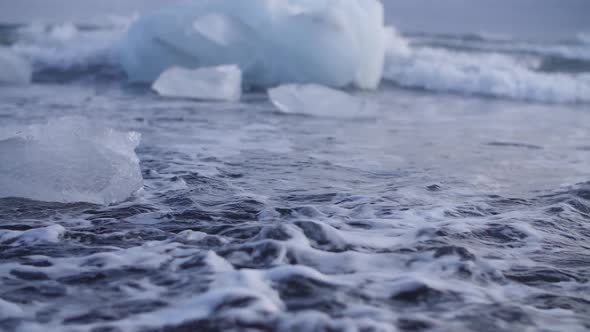 Melting glaciers. Global warming. Ice. Glacier. Ecology. Glaciers of Iceland. Waves in the ocean.