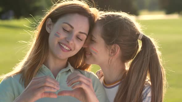 Portrait of Happy Lgbt Couple Cuddling Outdoors