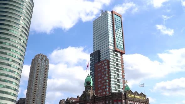 Skyscrapers and waving flags near famous Hotel American on Kop van Zuid Rotterdam