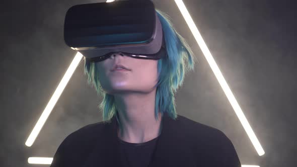Young Man with Colored Hair Wearing Virtual Reality Glasses