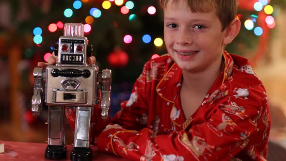 Portrait of boy with robot on Christmas alt