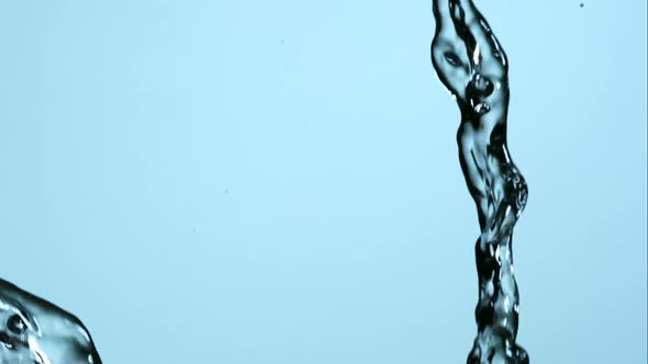 Water pouring and splashing in ultra slow motion 1500fps on a reflective surface - WATER POURS 