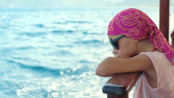 Young Girl in Bad Mood Looking Into Sea During Journey on Sea Ship