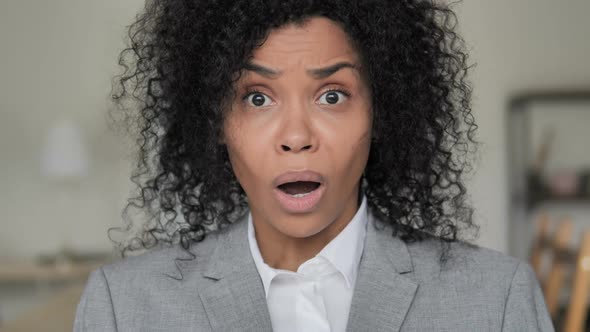 Shocked African Businesswoman Reacting to Loss