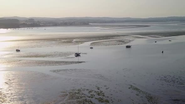 Seabed, low tide, stranded yachts. Lympstone. England. Aerial view.