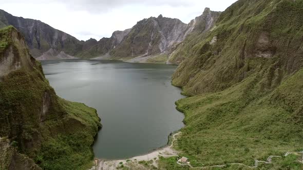 Aerial view of volcanic Lake Pinatubo and mountains, Porac, Philippines.