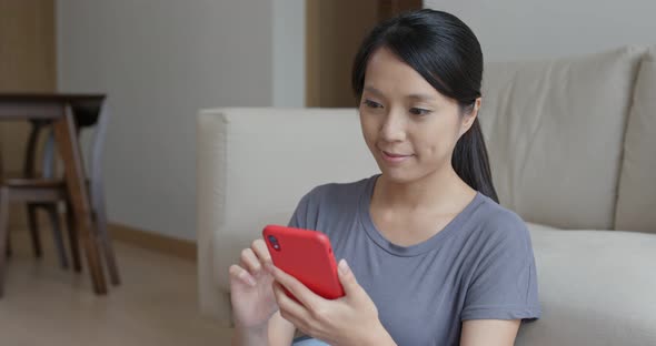 Woman use of mobile phone at home