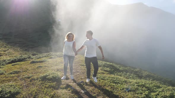 Couple running on a foggy day