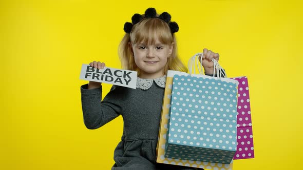 Child Girl Showing Black Friday Inscription Text Advertisement. Online Shopping with Low Prices