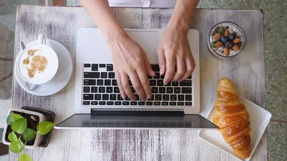 Trendy Top View Of Woman Hands Working On Laptop Computer At Cafe.