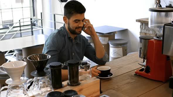 Male business executive using mobile phone