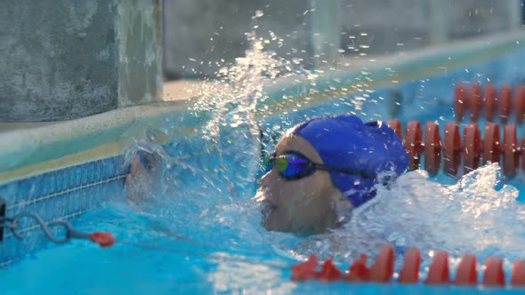 Female swimmer disappointed and splashes water in pool 4k