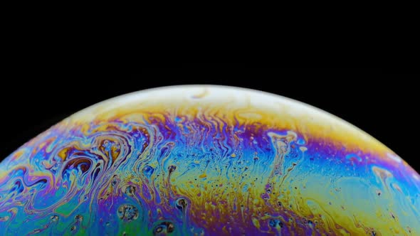 Rainbow Soap Bubble on a Dark Background