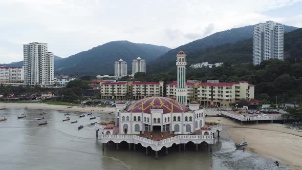 Orbit shot of the Tanjung Bungah Floating Mosque in Penang Malaysia