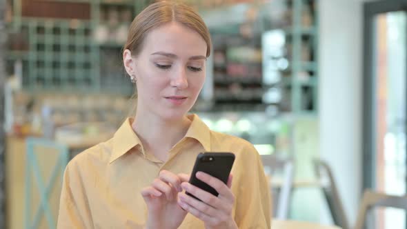 Portrait of Young Woman Using Smartphone