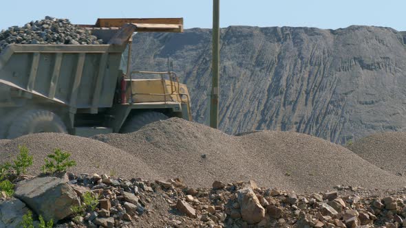 A Large Truck Transports Ore at an Industrial Plant
