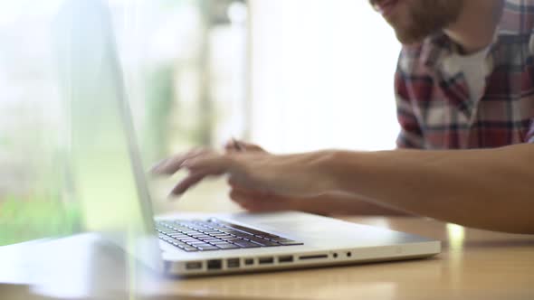 Man using laptop at home