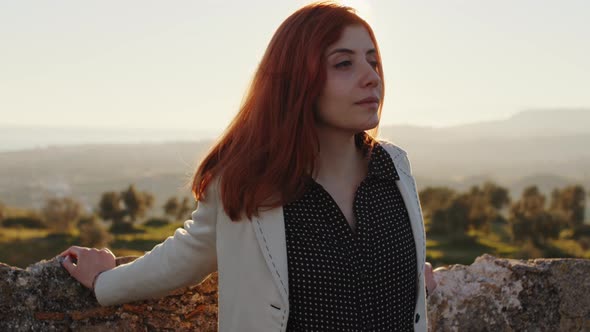 Young girl looks at nature