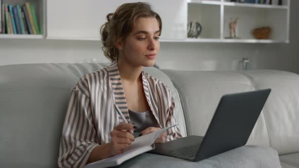 Manager Watching Online Training in Pajamas Closeup