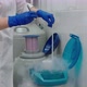 Young Woman Laboratory Assistant in Mask Is Working in DNA Laboratory with Cryostat - VideoHive Item for Sale