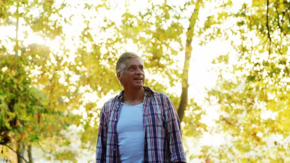 Senior man with arms outstretched