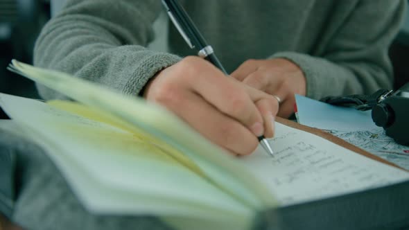 Woman Write in Travel Diary During Train Trip