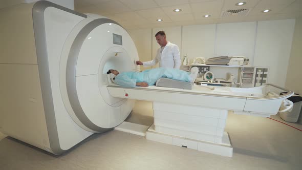 Magnetic Resonance Imaging Adult Professional Doctor Performs a Magnetic Tomographic Examination of