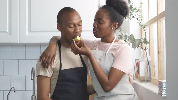 Happy Married Couple Show Their Tender Feelings While Cooking