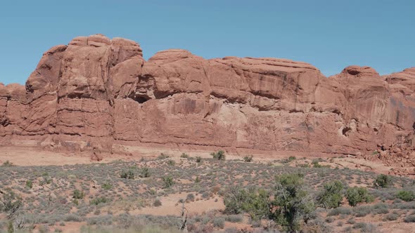 Red Orange Massive Cliff Formation In Arches Park On A Sunny Day In Motion