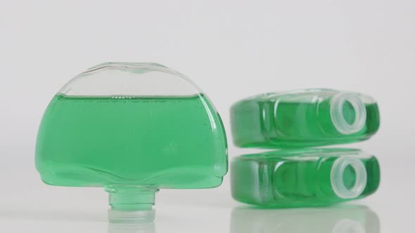 Plastic toilet bowl deodorizers with green gel slow tilt 4K video