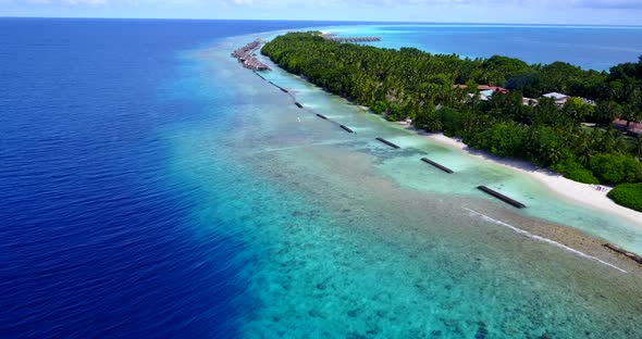 Luxury above clean view of a sandy white paradise beach and blue sea background in high resolution 4