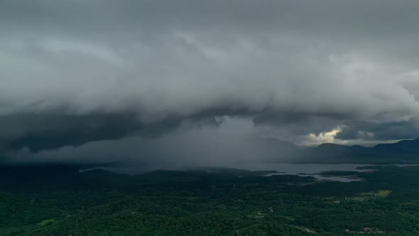 Thunderstorm storms and black clouds moving over the mountains.