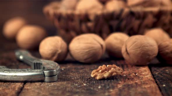 Super Slow Motion Peeled Walnut Falls on the Table