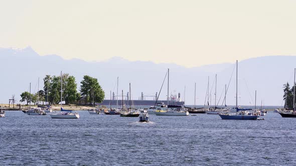 a summer day at Nanaimo harbor front with boats taking a ride on the west coast, Vancouver Island, B