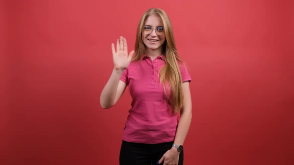 Happy Beautiful Woman Saying Hi and Smiling Welcoming Friends with Hand