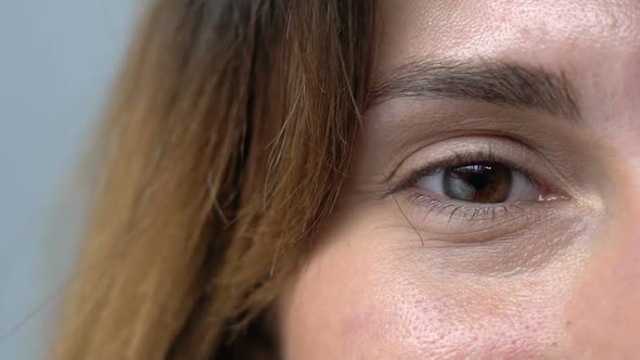 Brown-Eyed Woman Smiling to Camera, Mimic Age Wrinkles and Problems With Skin