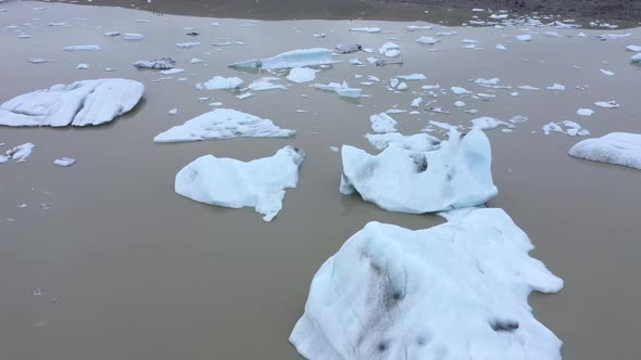 Aerial View of Floating Icebergs in Fjallsarlon Glacier, Iceland. Climate Change, Global War Concept