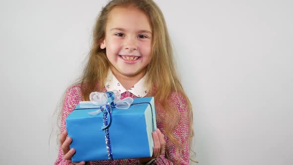 Pretty Girl Catches a Gift That Falls From Above