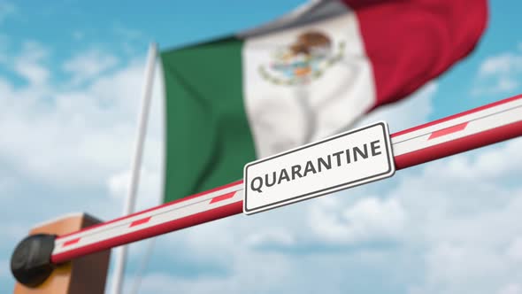 Opening Barrier with QUARANTINE Sign at the Mexican Flag