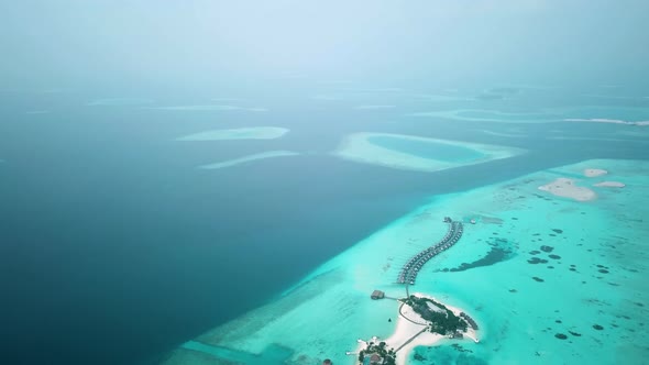 Aerial Drone View of a Beautiful Atoll or Island with a Resort in the Maldives