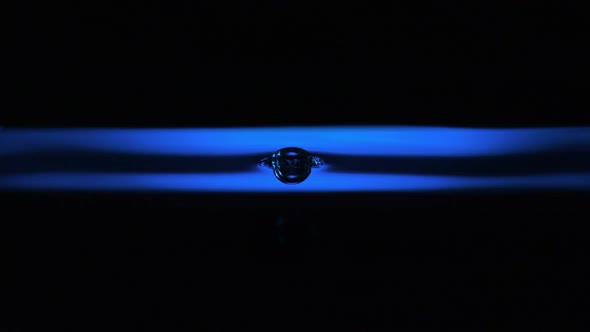 Water ripple with blue lightr, Slow Motion