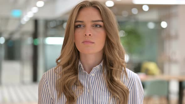 Portrait of Businesswoman Pointing at the Camera 