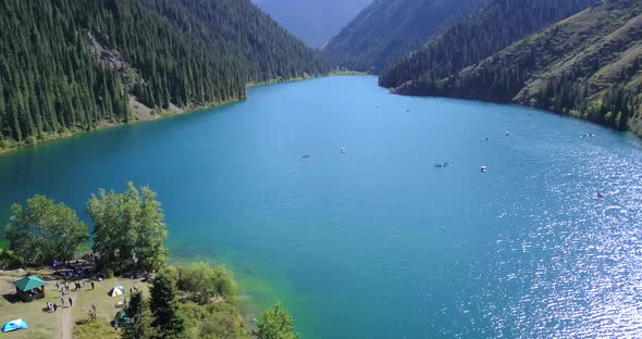 Kolsay Lake Among Green Hills and Mountains.