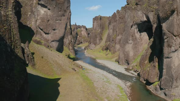 Amazing Drone Flying Through Icelandic Canyon Covered with Green Moss